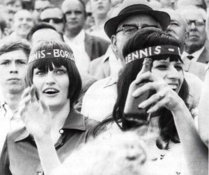 Two female fans of Tennis Borussia Berlin inside the stadium in the 1970s, shown on a black and white picture. One woman is holding a beer - Copyright: Archiv Tennis Borussia Berlin